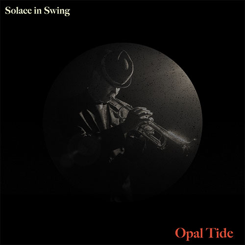 A vinyl cover in dark gray and black tones, with a central circle highlighting a man wearing a hat and blowing a trumpet.