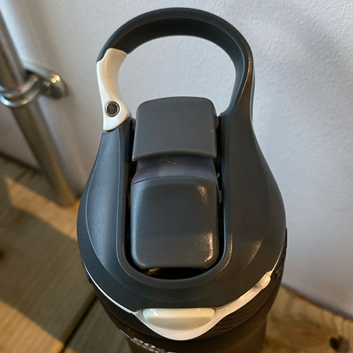 top birds eye view of the black water bottle cap, drinking spout